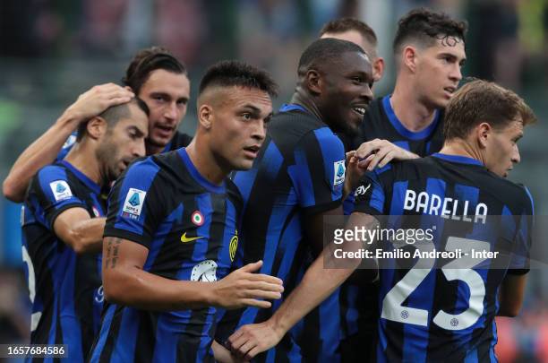 Marcus Thuram of FC Internazionale celebrates with teammate Lautaro Martinez and Nicolo Barella after scoring the team's first goal during the Serie...