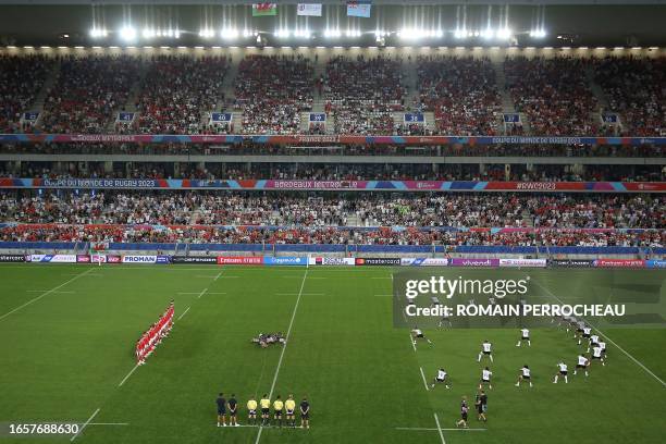 Fiji's players perform the Cibi dance prior to the France 2023 Rugby World Cup Pool C match between Wales and Fiji at Stade de Bordeaux in Bordeaux,...