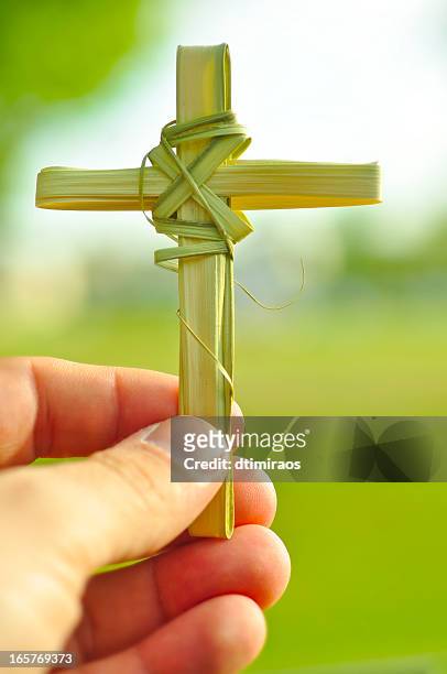 cross made out of palm fronds. - palm sunday stock pictures, royalty-free photos & images