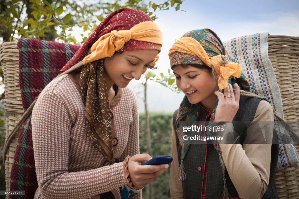 People of Himachal Pradesh: Beautiful young women using mobile phone