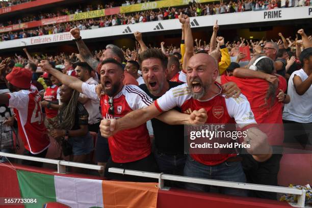 Arsenal fans celebrate the 2nd goal during the Premier League match between Arsenal FC and Manchester United at Emirates Stadium on September 03,...