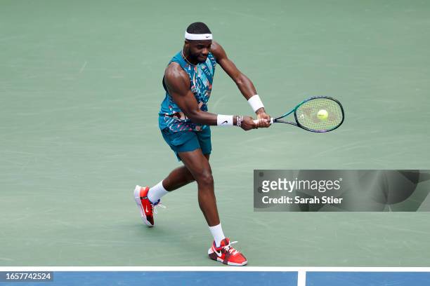 Frances Tiafoe of the United States returns a shot against Rinky Hijikata of Australia during their Men's Singles Fourth Round match on Day Seven of...
