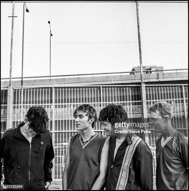 British rock group Blur pose under London's Westway, 20th July 1995. From left to right, bassist Alex James, singer Damon Albarn, guitarist Graham...