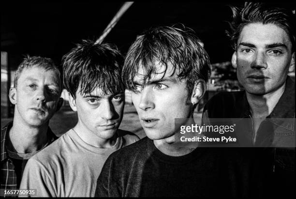 British rock group Blur pose under London's Westway, 20th July 1995. From left to right, drummer Dave Rowntree, guitarist Graham Coxon, bassist Alex...