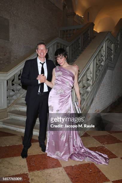Paul Anderson and Milla Jovovich attend Miu Miu Women's Tales Dinner during the 80th Venice International Film Festival at Fondazione Prada on...