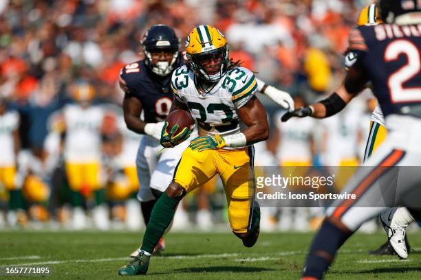 Green Bay Packers running back Aaron Jones runs with the ball in the first quarter during a regular season game between the Green Bay Packers and the...