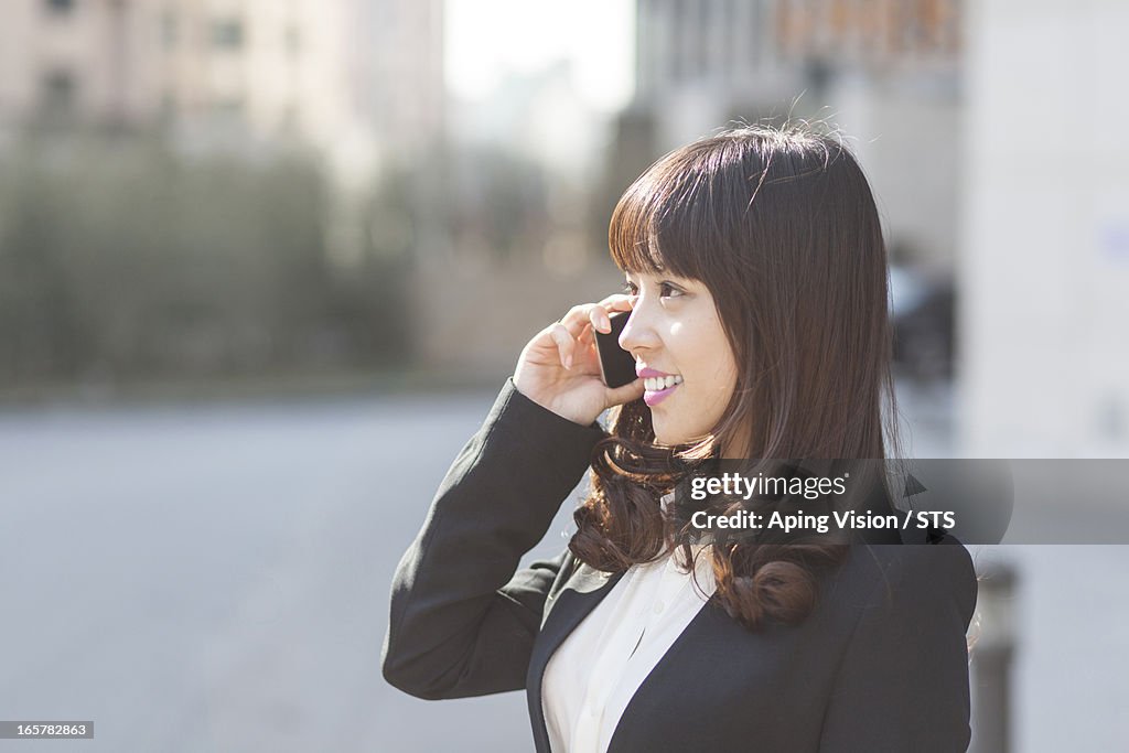 Young businesswoman using mobile phone