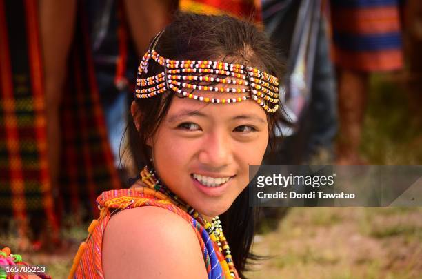 Young girl from the Igorot mountain tribe wait for the start of the parade during the celebration of the Lang Ay Festival in Bontoc on April 6, 2013...