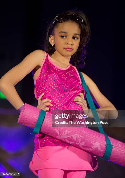 Nina Waters shows off a yoga oufit complete with a yoga mat on stage during the 3rd Annual Glynn Jackson's Show Biz Kidz at The Silver Spring Civic...