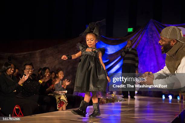 Tamara Dade, 4 heads toward the end of the runway where loud cheering, including her grandfather Rico Johnson greets her at the 3rd Annual Glynn...