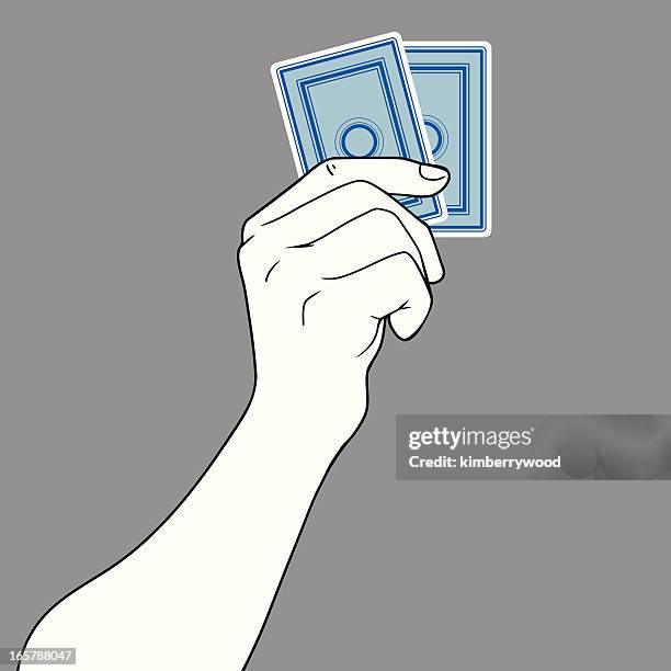 hand holding zwei karten - black jack hand stock-grafiken, -clipart, -cartoons und -symbole