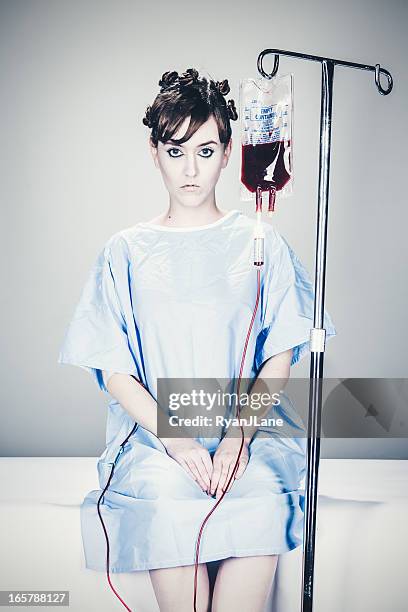 hospital patient with iv drip - lightskinned stock pictures, royalty-free photos & images