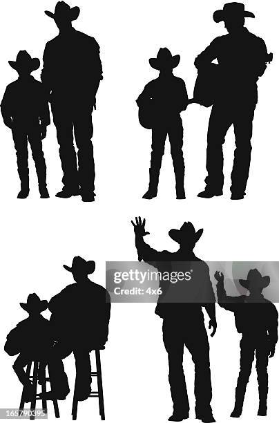 silhouette of a cowboy with his son - family fun indoor stock illustrations