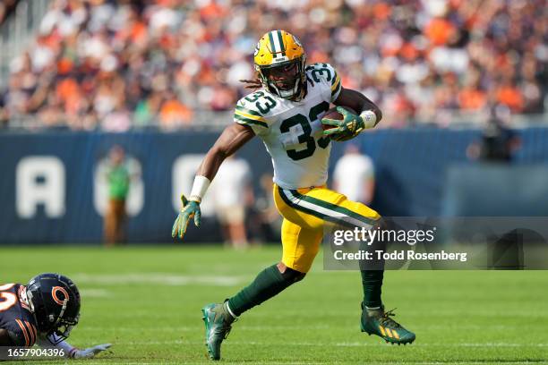 Running Back Aaron Jones of the Green Bay Packers runs the ball during an NFL football game against the Chicago Bears at Soldier Field on September...