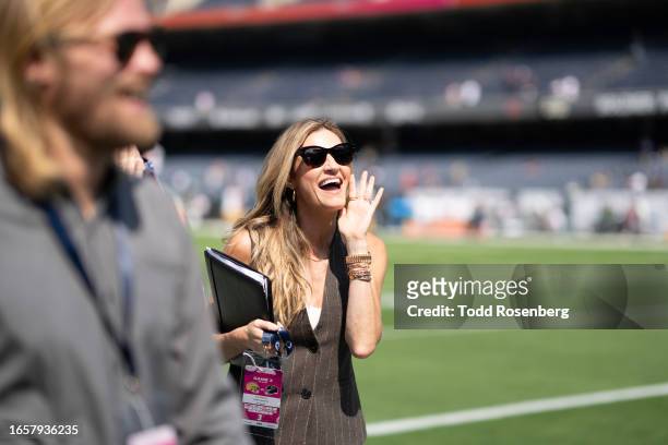 Sideline Reporter Erin Andrews of Fox smiles on during an NFL football game between the Green Bay Packers and Chicago Bears at Soldier Field on...