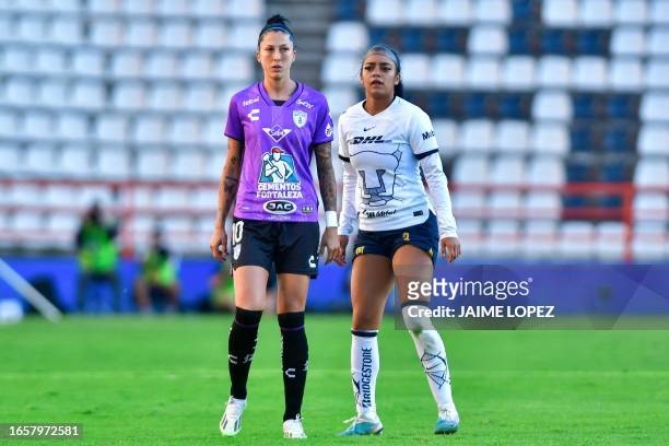 Pachuca's Spanish midfielder Jenni Hermoso stands on the field next to Pumas' defender Ana Mendoza during the women's Mexican football league match...