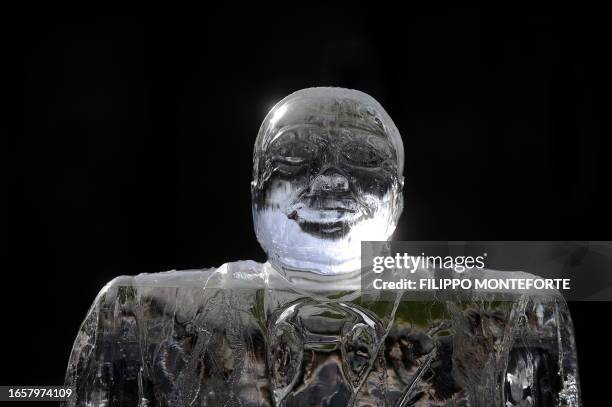 An ice statue showing Italian Prime Minister Silvio Berlusconi is displayed during an action organized by Greenpeace environmental group activists...