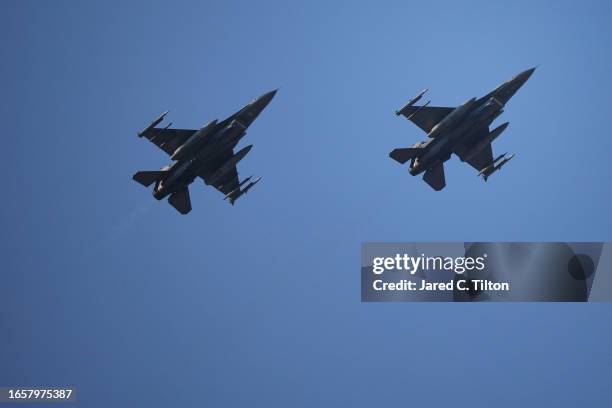 The F-16 169th Fighter Wing perform a flyover during pre-race ceremonies prior to the NASCAR Cup Series Cook Out Southern 500 at Darlington Raceway...