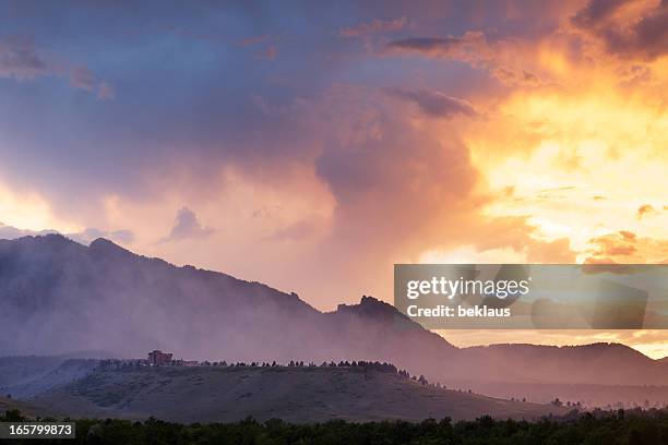 dramatic smoke and fog mountain scene - denver sunrise stock pictures, royalty-free photos & images