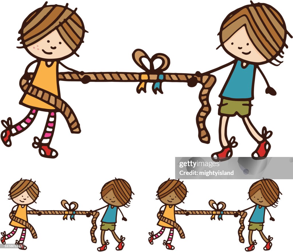 Ragazzo e ragazza giocare tira la corda