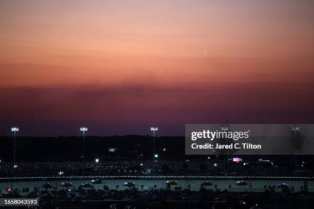 Cars are seen on track as lighting in turns three and four is not illuminated during the NASCAR Cup Series Cook Out Southern 500 at Darlington...
