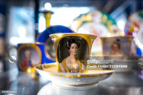 Neoclassical white and gold mug with medallion decoration of Archduchess Sophie of Austria expected to fetch between 200 and 300 Swiss francs is...