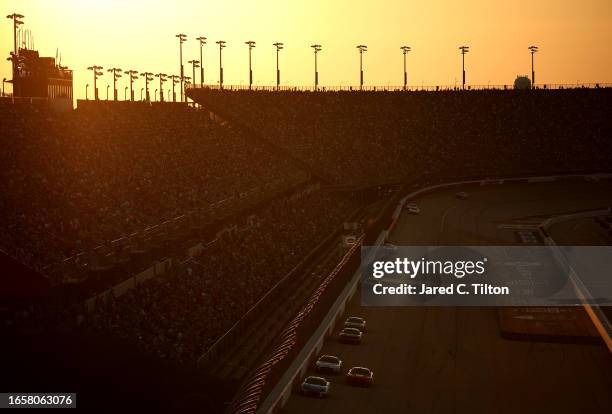 Cars are seen on track as lighting in turns three and four is not illuminated during the NASCAR Cup Series Cook Out Southern 500 at Darlington...