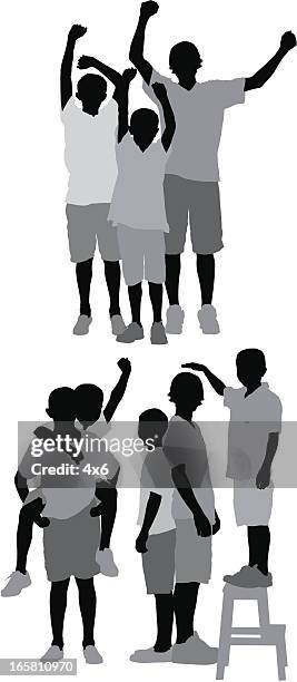 silhouette of three boys playing - family fun indoor stock illustrations