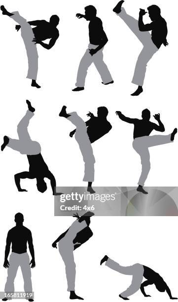 man practicing capoeira - capoeira stock illustrations