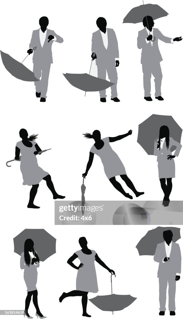 People posing with umbrellas