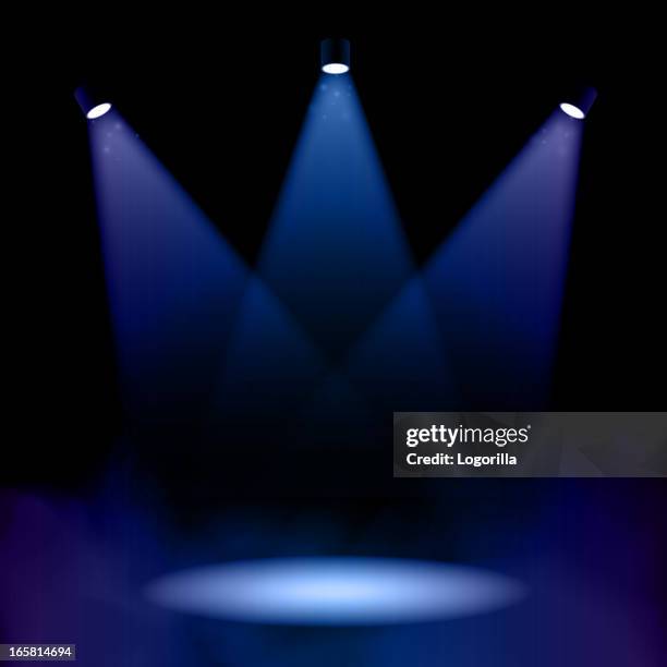 stage lighting with fog - dark blue background stock illustrations