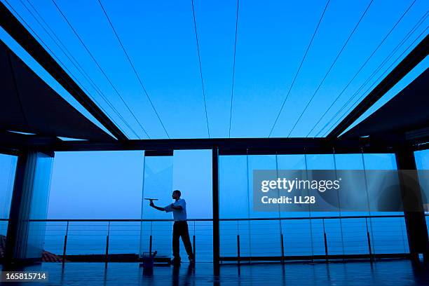 glass cleaning - professional cleaner stock pictures, royalty-free photos & images