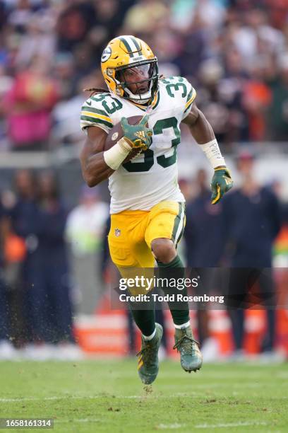 Running Back Aaron Jones of the Green Bay Packers runs the ball during an NFL football game against the Chicago Bears at Soldier Field on September...