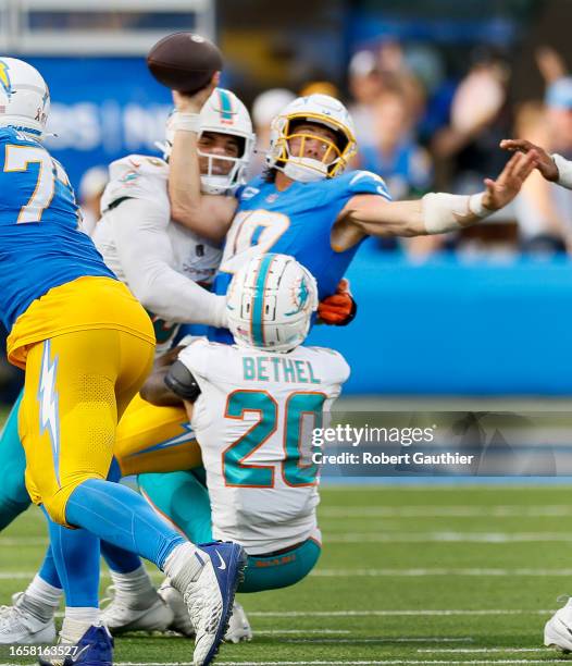 Inglewood, CA, Sunday, Sept. 10, 2023 - Los Angeles Chargers quarterback Justin Herbert is sacked by Miami Dolphins linebacker Jaelan Phillips and...