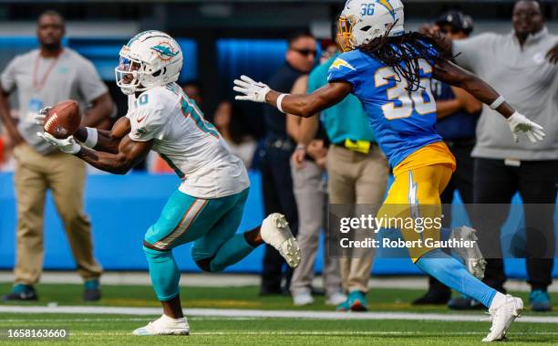 Inglewood, CA, Sunday, Sept. 10, 2023 - Miami Dolphins wide receiver Tyreek Hill hauls in a 47-yard pass over Los Angeles Chargers cornerback Ja'Sir...