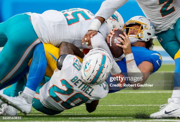 Inglewood, CA, Sunday, Sept. 10, 2023 - Los Angeles Chargers quarterback Justin Herbert is sacked by Miami Dolphins linebacker Jaelan Phillips and...