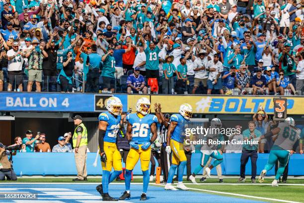 Inglewood, CA, Sunday, Sept. 10, 2023 - A legion of Dolphins fans celebrate after Tyreek Hill scored the game-winning touchdown at SoFi Stadium.