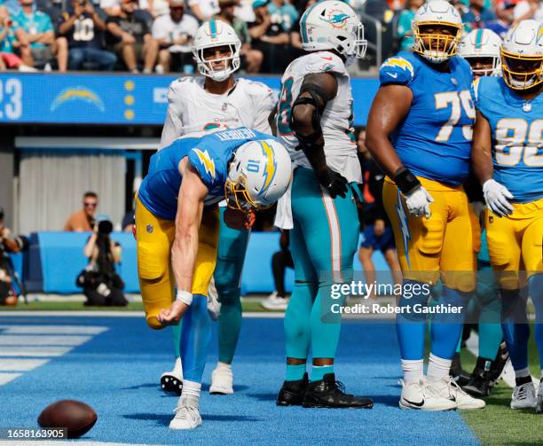 Inglewood, CA, Sunday, Sept. 10, 2023 - Los Angeles Chargers quarterback Justin Herbert spikes the ball after scoring a third quarter touchdown...