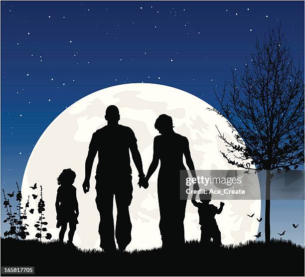 young family at night in silhouette against the moon - family in the park stock illustrations