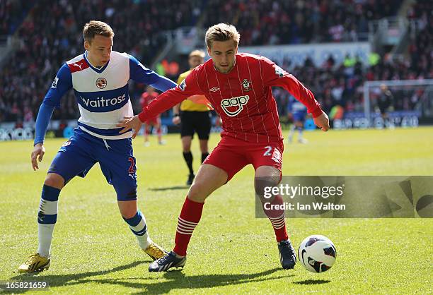 Luke Shaw of Southampton is closed down by Chris Gunter of Reading during the Barclays Premier League match between Reading and Southampton at the...