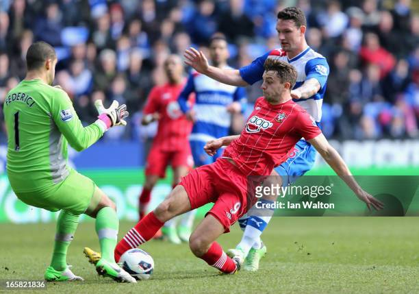 Jay Rodriguez of Southampton scores the opening goal past keeper Adam Federici of Reading during the Barclays Premier League match between Reading...
