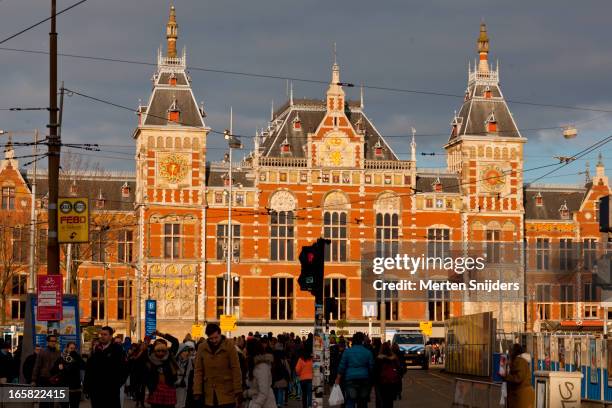 central station lit by warm sunlight - centraal station stock pictures, royalty-free photos & images