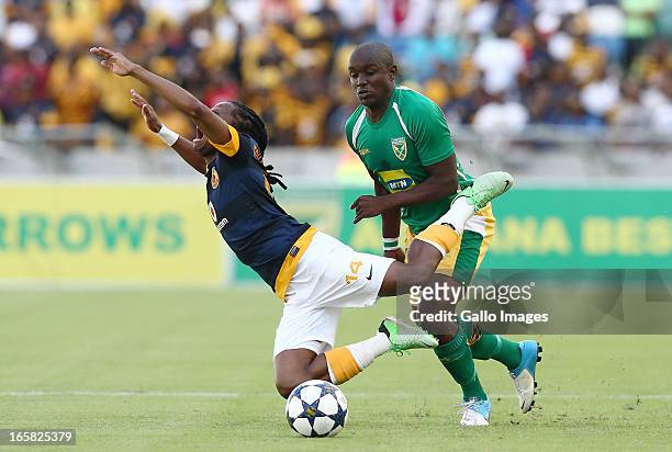 Jabulani Nene brings down Siphiwe Tshabalala during the Absa Premiership match between Golden Arrows and Kaizer Chiefs at Moses Mabhida Stadium on...