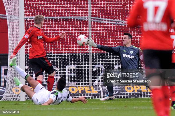 Andre Schuerrle of Leverkusen scores the opening goal during the Bundesliga match between Bayer 04 Leverkusen and VfL Wolfsburg at BayArena on April...