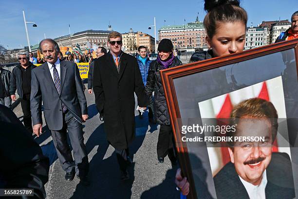 Former U.S. Congressman Patrick J. Kennedy II, with his wife Amy Petitgout and Mehdi Abrishamchi of NACP during a rally in Stockholm, on April 6,...
