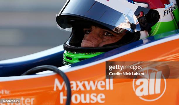 Dario Franchitti of Scotland, driver of the Target Chip Ganassi Racing Banana Boat Honda sits in his car during practice for the Honda Indy Grand...