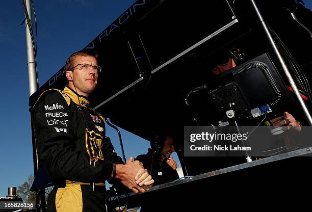 Sebastien Bourdais of France, driver of the Dragon Racing Chevrolet, stands on pit wall prior to practice for the Honda Indy Grand Prix of Alabama at...