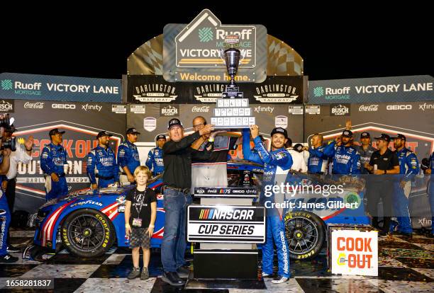 Kyle Larson, driver of the HendrickCars.com Chevrolet, celebrates in victory lane after winning the NASCAR Cup Series Cook Out Southern 500 at...