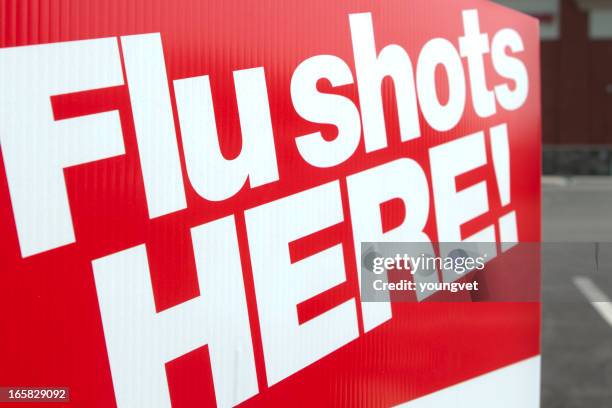 flu shots here - get your flu shot sign stock pictures, royalty-free photos & images