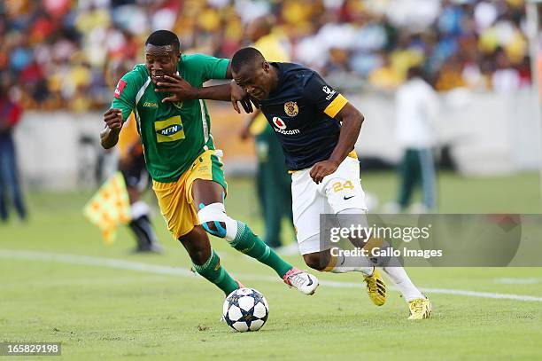 Tsepo Masilela holds off Thamsanqa Gabuza during the Absa Premiership match between Golden Arrows and Kaizer Chiefs at Moses Mabhida Stadium on April...